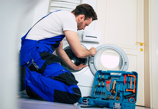 Technician repairing an LG washing machine in Vancouver